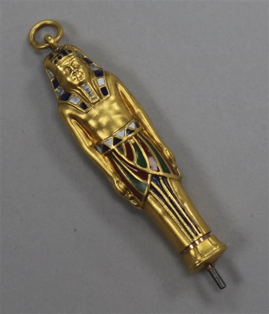 An Egyptian novelty yellow metal and polychrome enamel propelling pencil, modelled as a Pharaoh, 42mm.